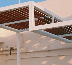 Modern metal pergola installed on a terrace with stylish design and durable finish